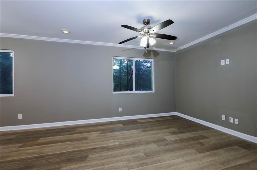1277 Goodwin Road Northeast, Unit 1275 Atlanta, GA 30324 - Photo 4 of 19 a view of a big room with wooden floor and windows