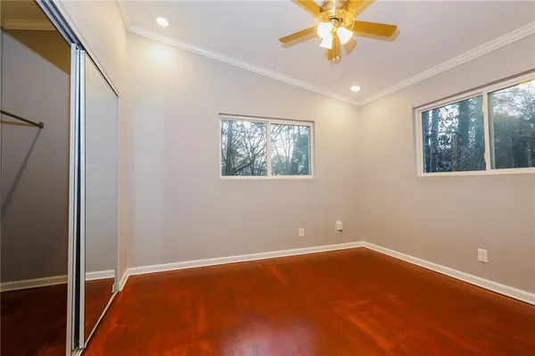 a view of room with window and ceiling fan