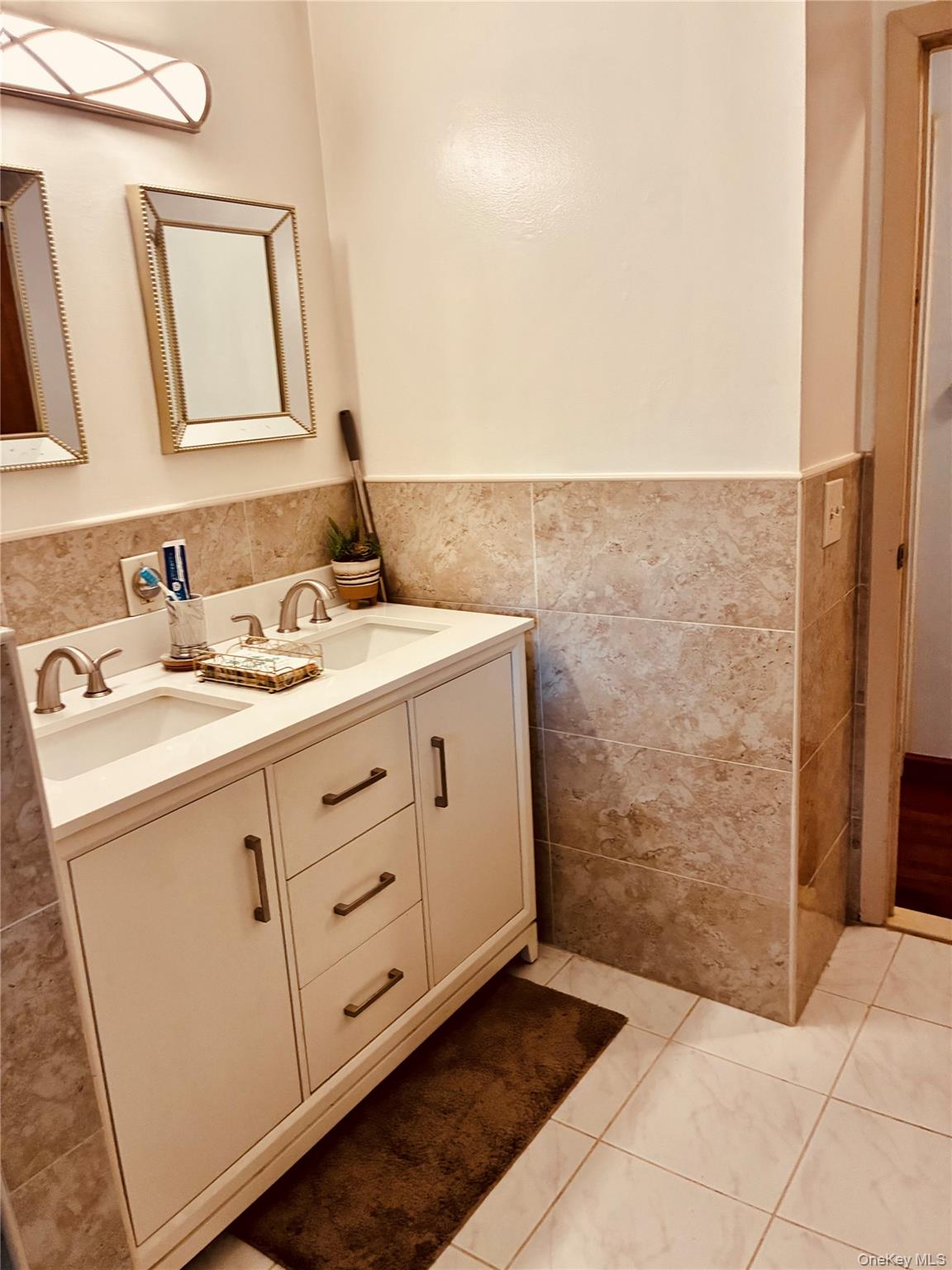 24 Ann Boulevard Spring Valley, NY 10977 - Photo 10 of 25 a bathroom with a sink and a mirror