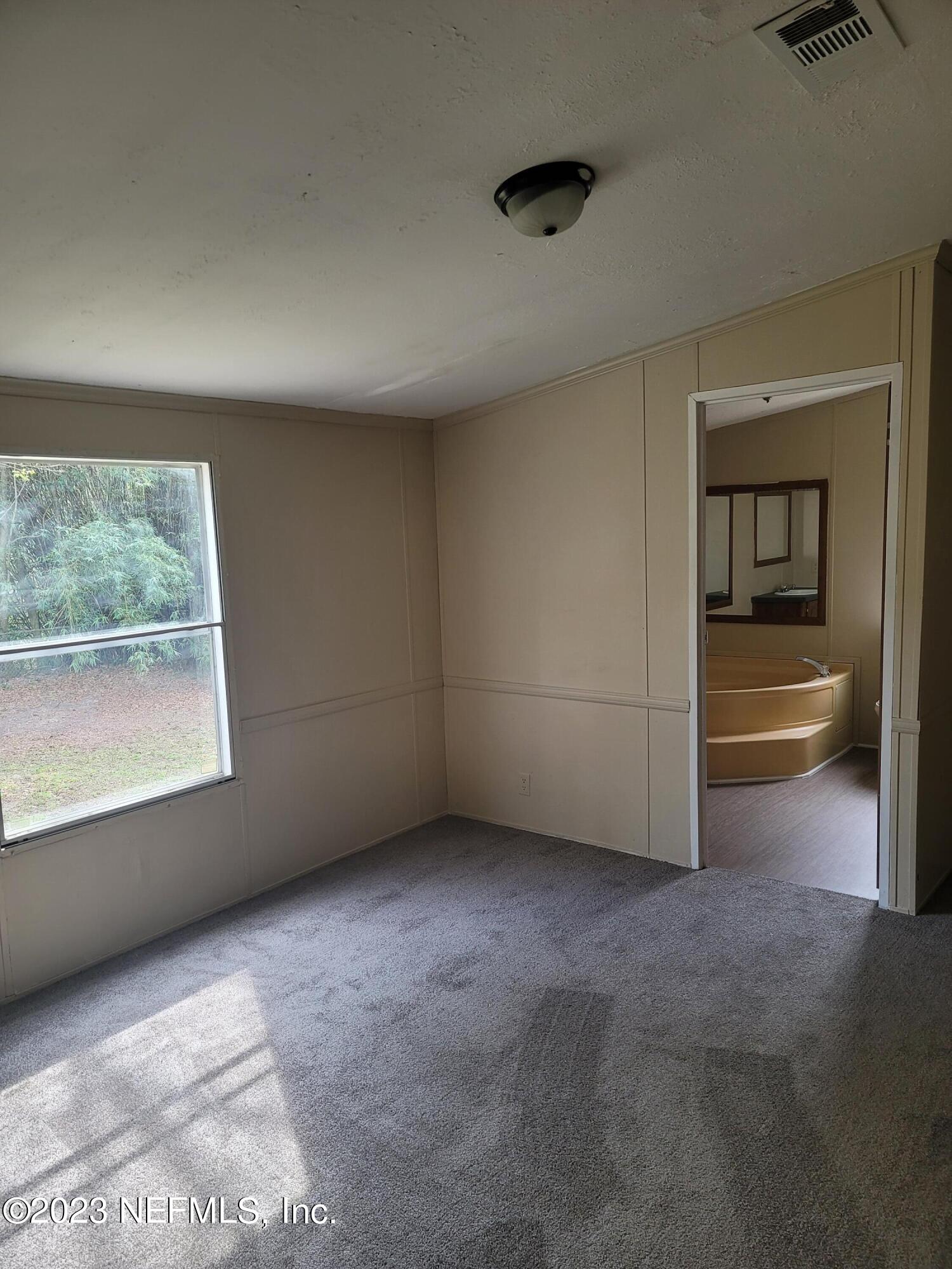 10029 Hogan Street Jacksonville, FL 32218 - Photo 4 of 38 20230217_140855