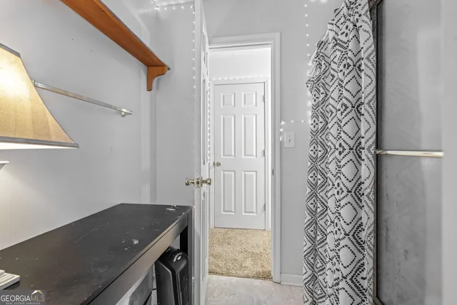 a view of a storage and utility room in a house
