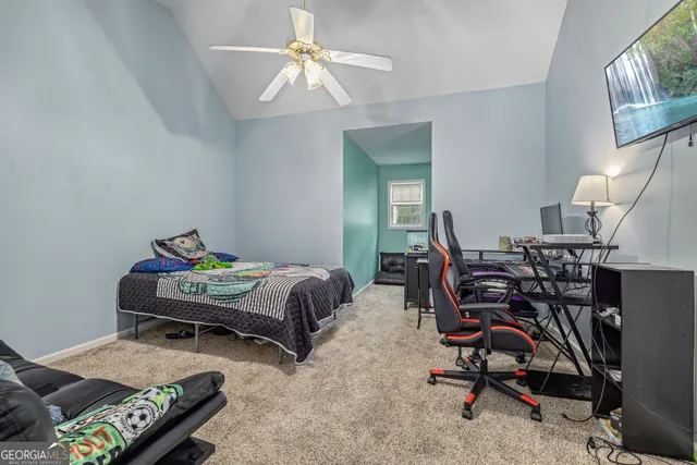 a bedroom with furniture and a chandelier