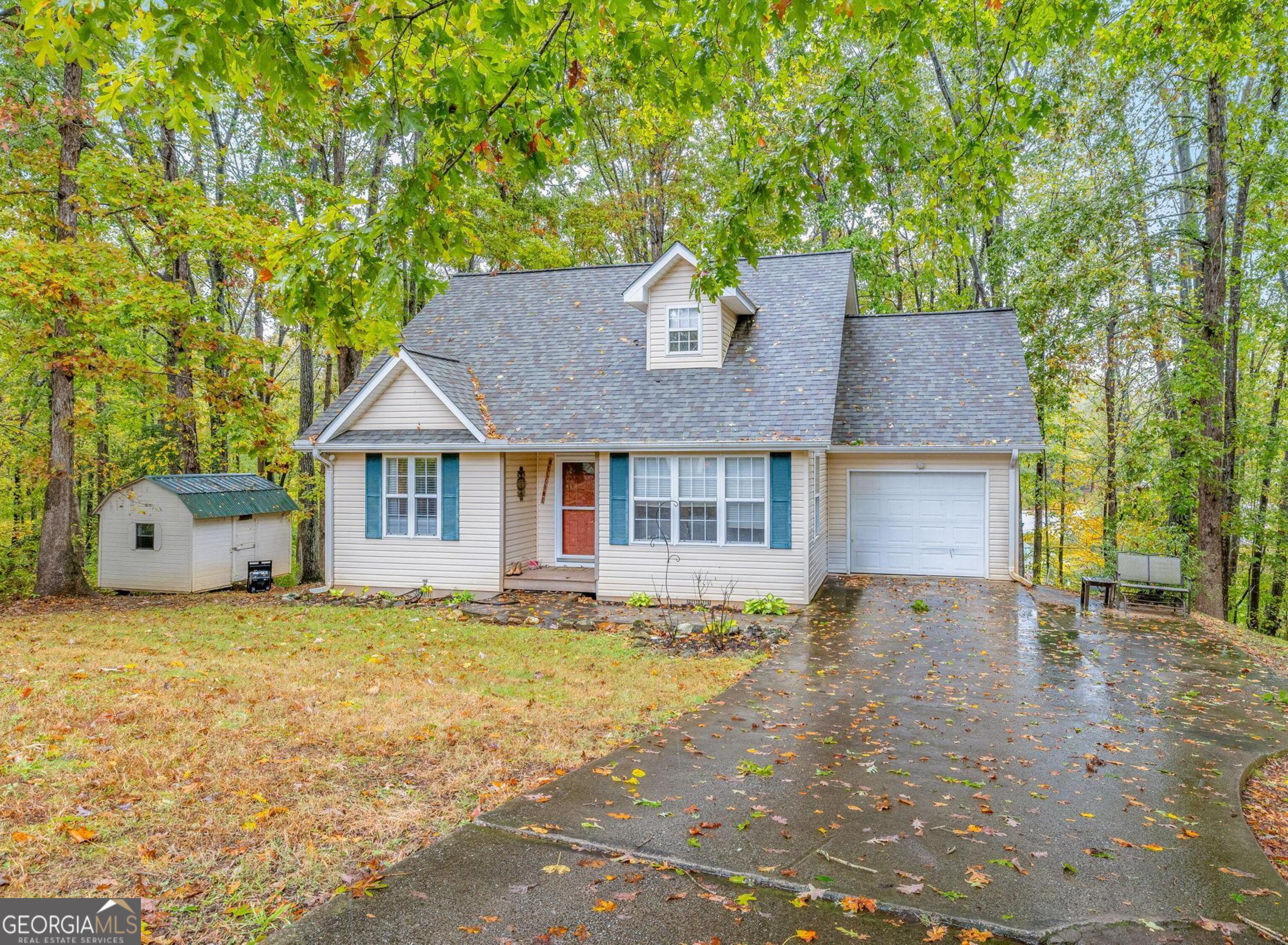 190 Sunset Oaks Drive Cornelia, GA 30531 - Photo 2 of 20 a front view of a house with a garden and yard
