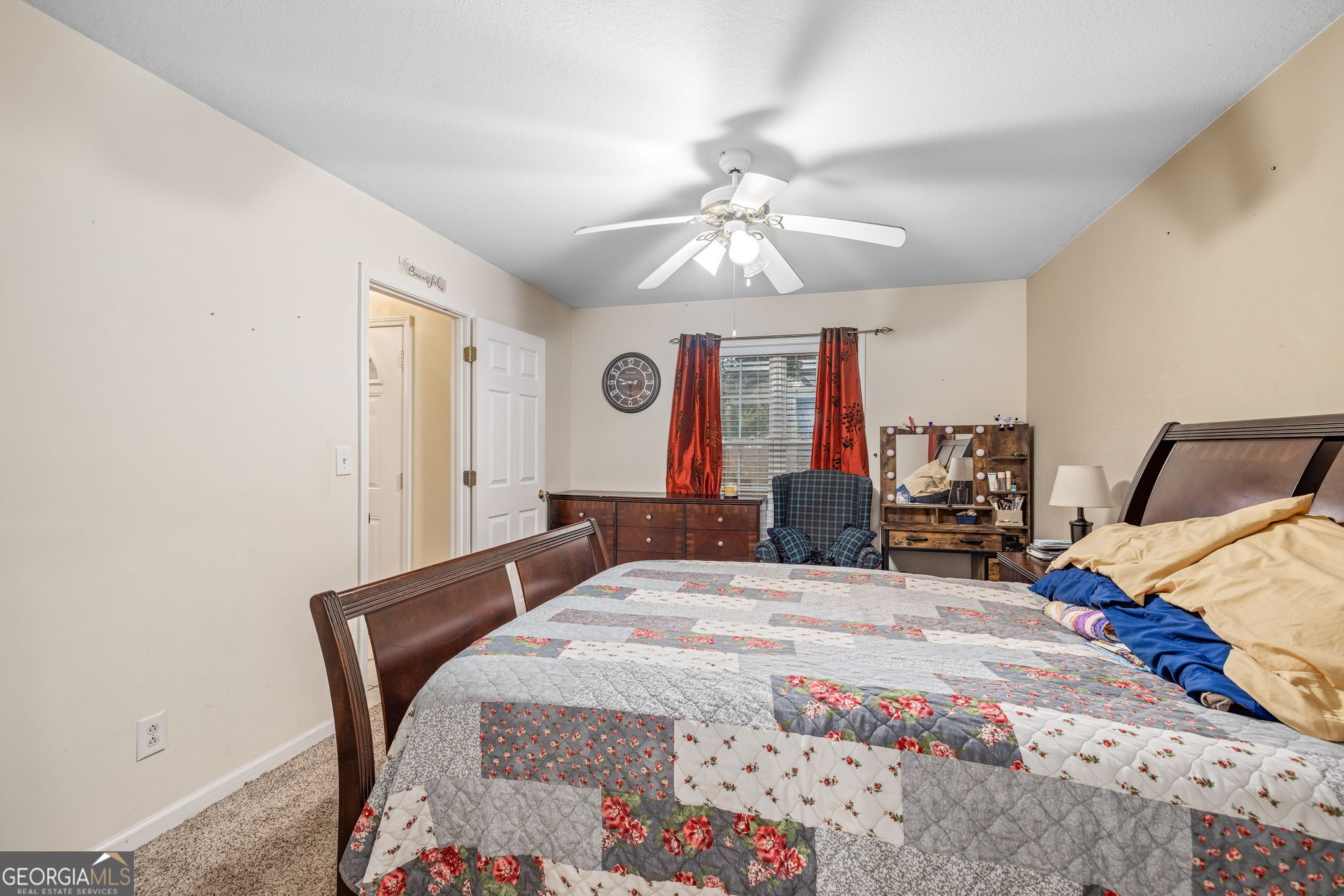 190 Sunset Oaks Drive Cornelia, GA 30531 - Photo 10 of 20 a bedroom with a bed a chandelier and dresser
