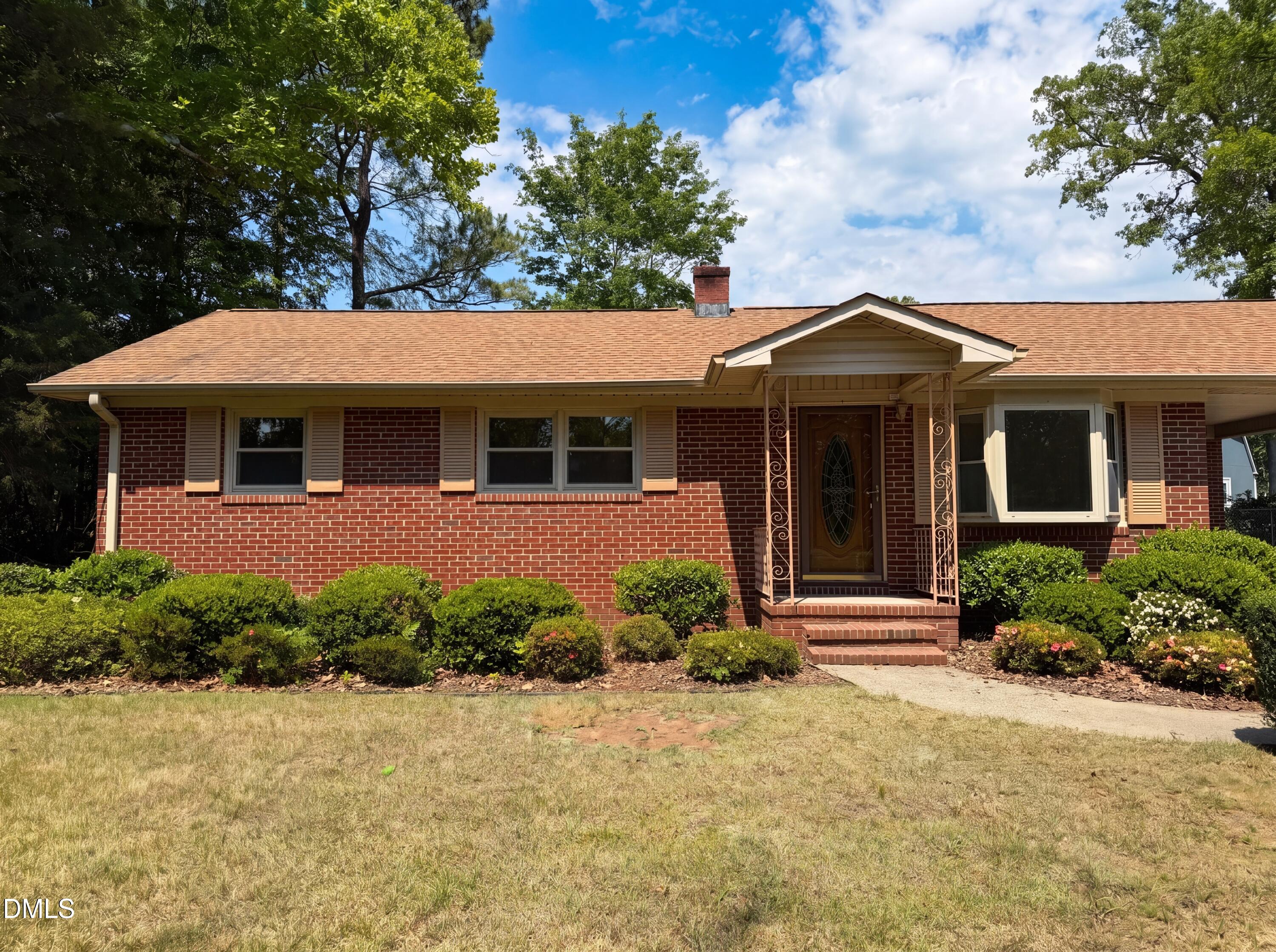 1710 West B Street Butner, NC 27509 - Photo 1 of 14 a front view of a house with a yard