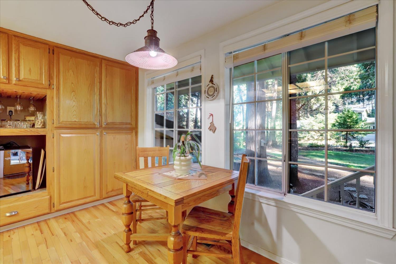 12746 Quaker Hill Cross Road Nevada City, CA 95959 - Photo 20 of 99 a view of a dining room with furniture window and outside view