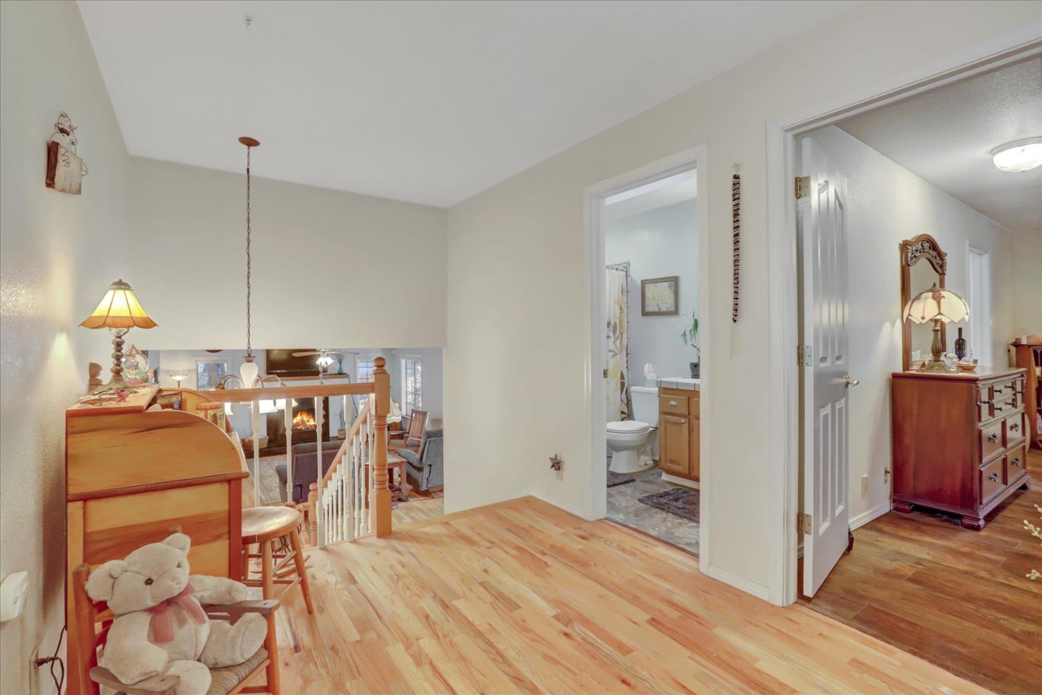 12746 Quaker Hill Cross Road Nevada City, CA 95959 - Photo 35 of 99 a view of a dining room with furniture and wooden floor