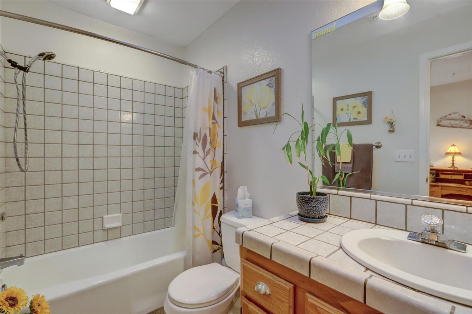 12746 Quaker Hill Cross Road Nevada City, CA 95959 - Photo 44 of 99 a bathroom with a sink a toilet and bathtub