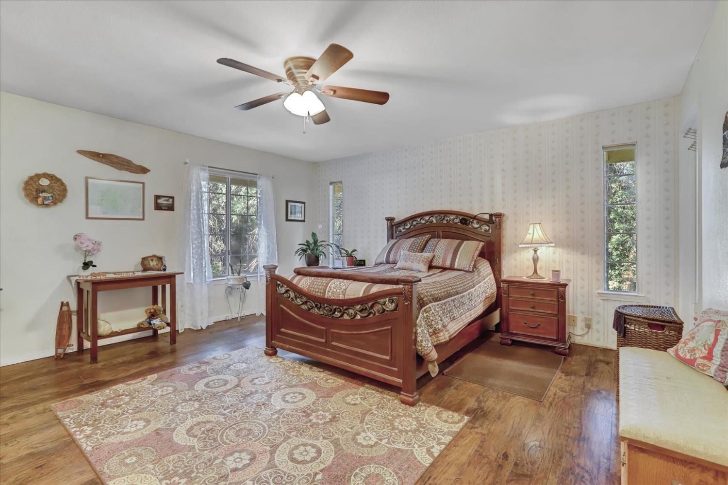 12746 Quaker Hill Cross Road Nevada City, CA 95959 - Photo 45 of 99 a bedroom with a bed wooden floor and window