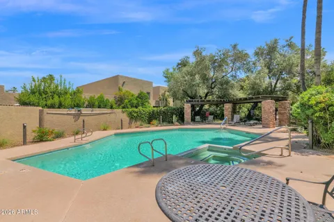 a view of a swimming pool with a patio