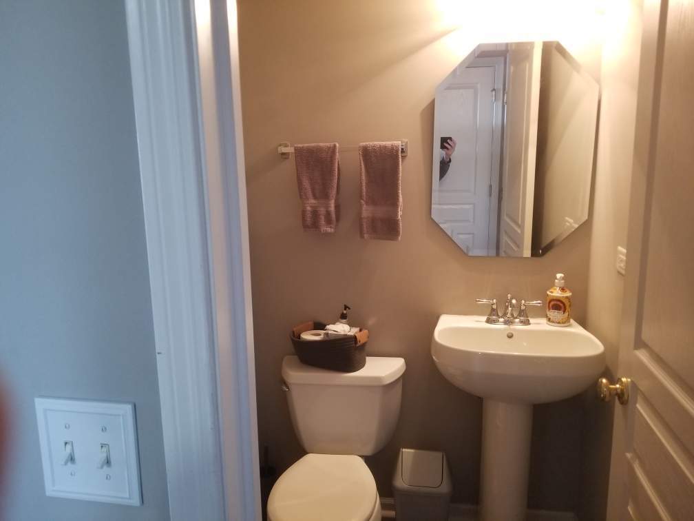 15322 Pinewood Road Lockport, IL 60441 - Photo 12 of 14 a bathroom with a toilet sink and mirror
