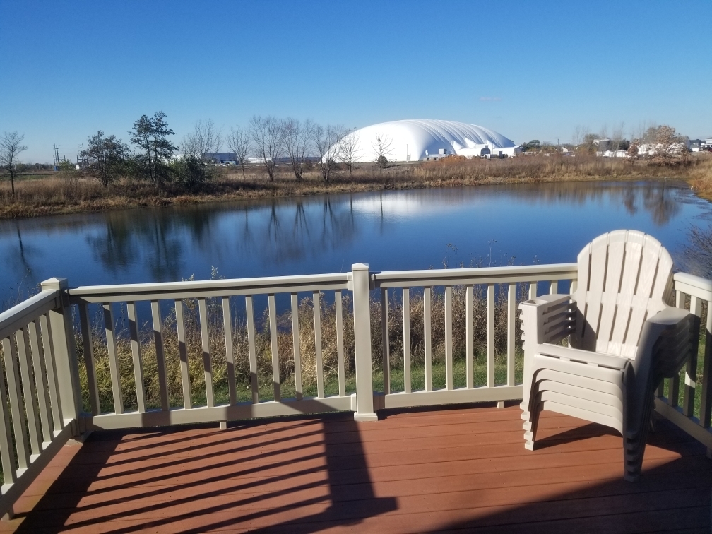 15322 Pinewood Road Lockport, IL 60441 - Photo 3 of 14 a view of a balcony with wooden chairs