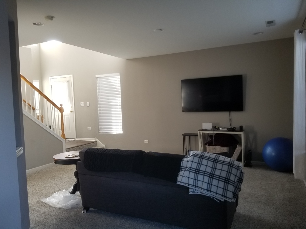 15322 Pinewood Road Lockport, IL 60441 - Photo 5 of 14 a living room with furniture and a flat screen tv