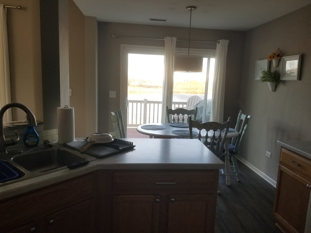 15322 Pinewood Road Lockport, IL 60441 - Photo 7 of 14 a view of a dining room with furniture window and outside view