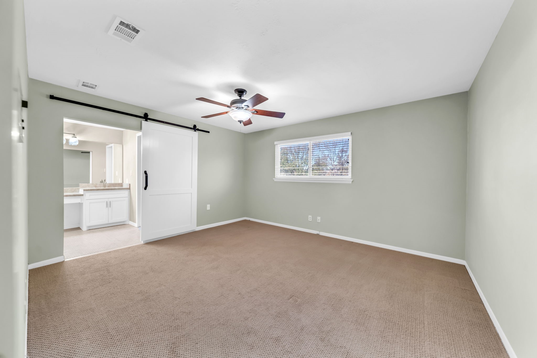 115 Heather Lane Conroe, TX 77385 - Photo 13 of 28 a view of an empty room with a bathroom