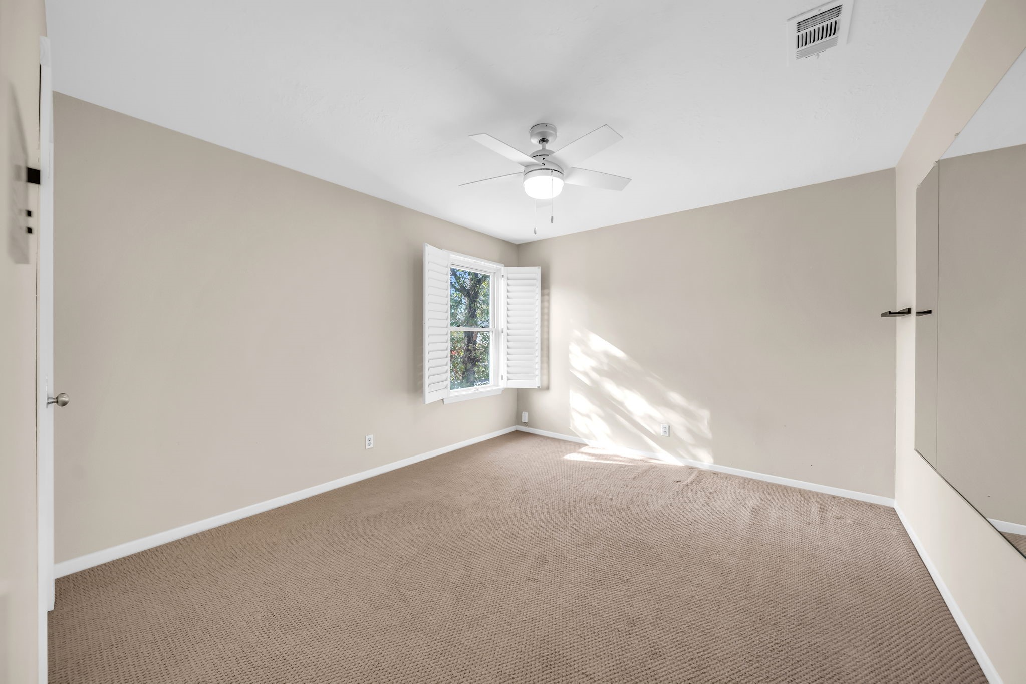 115 Heather Lane Conroe, TX 77385 - Photo 17 of 28 a view of empty room with window