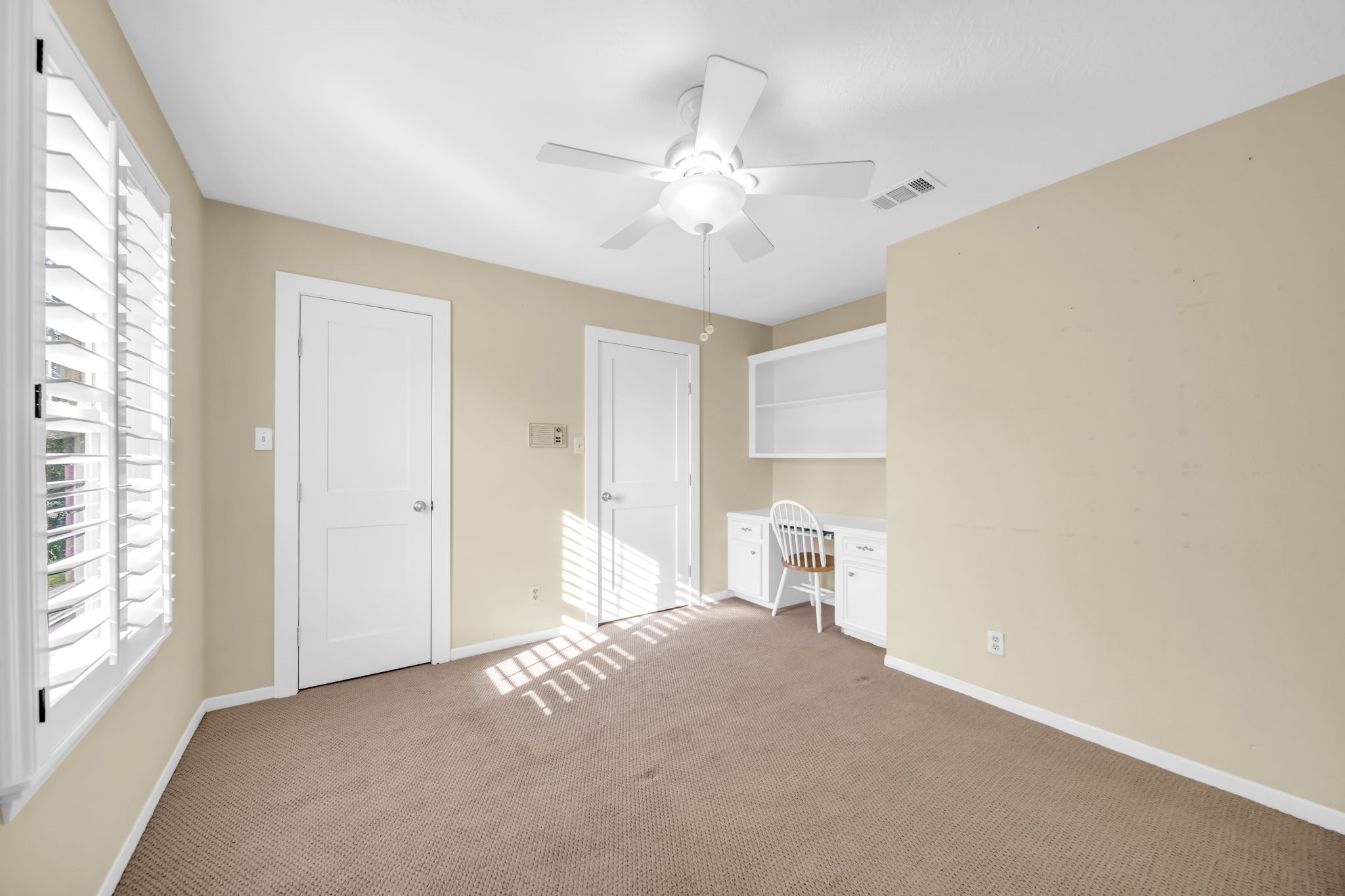 115 Heather Lane Conroe, TX 77385 - Photo 19 of 28 a view of empty room with a fireplace and fan