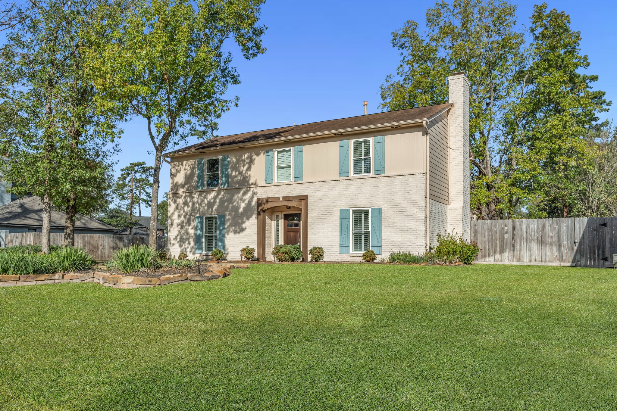 115 Heather Lane Conroe, TX 77385 - Photo 28 of 28 a front view of a house with a yard