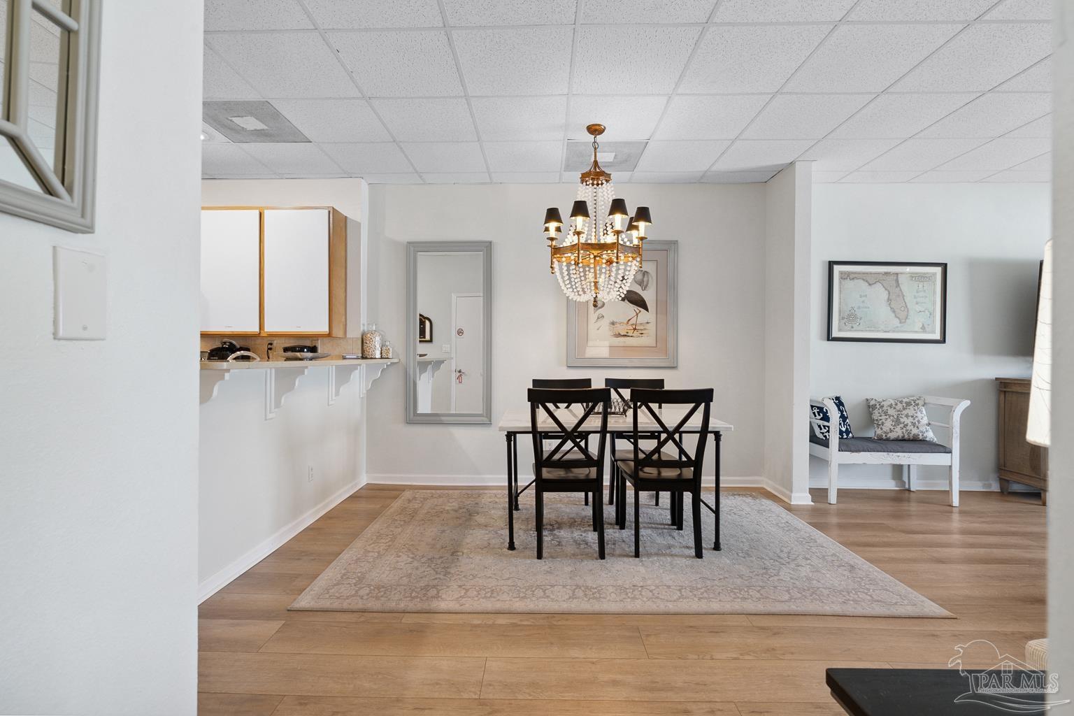 999 Fort Pickens Road, Unit 204 Pensacola Beach, FL 32561 - Photo 13 of 48 a dining room with furniture and window