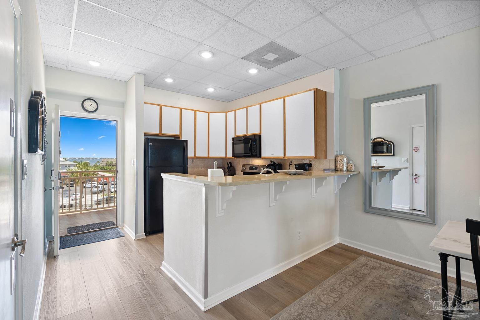 999 Fort Pickens Road, Unit 204 Pensacola Beach, FL 32561 - Photo 19 of 48 a view of kitchen with sink and refrigerator