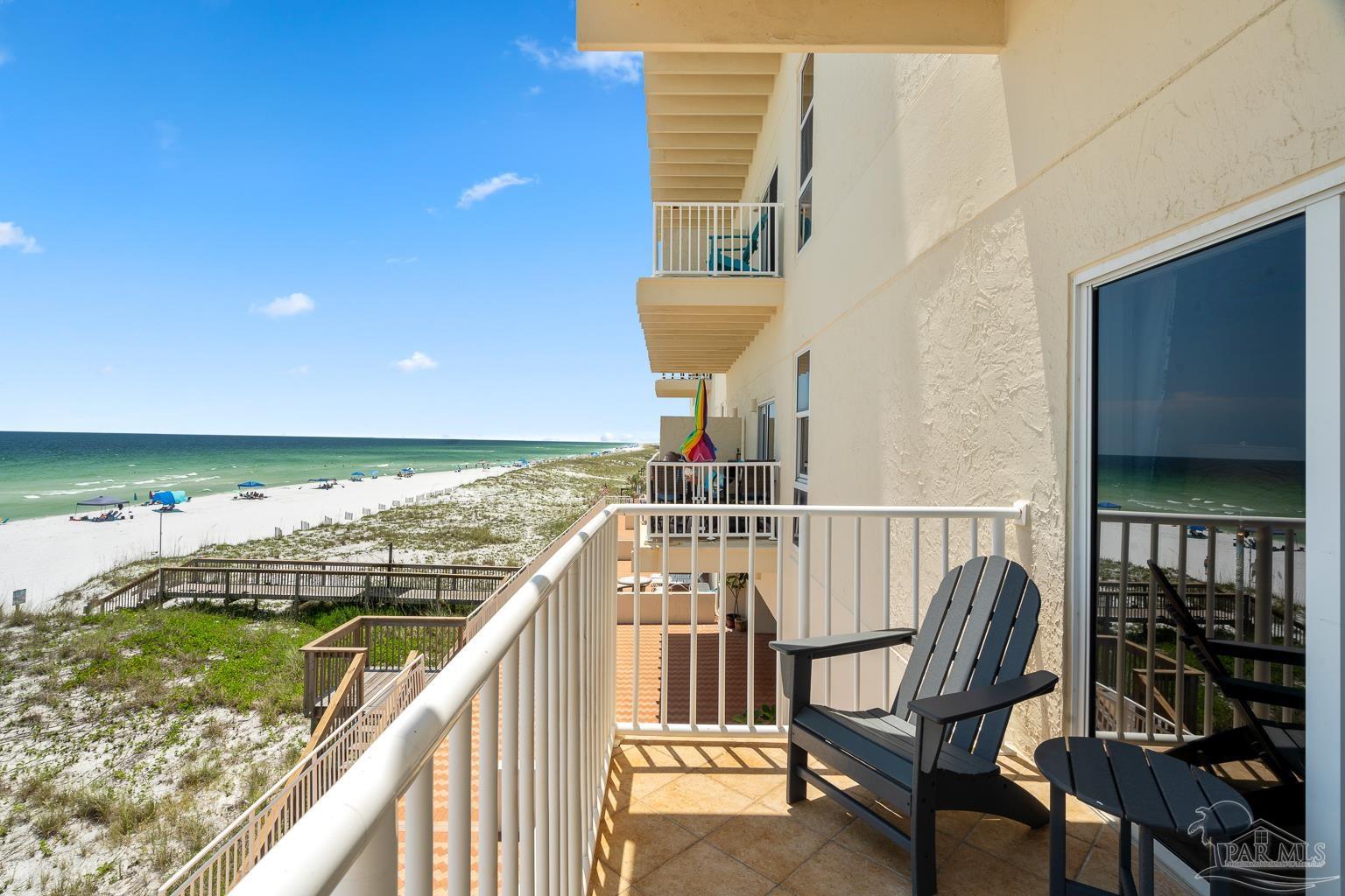 999 Fort Pickens Road, Unit 204 Pensacola Beach, FL 32561 - Photo 30 of 48 a balcony with table and chairs