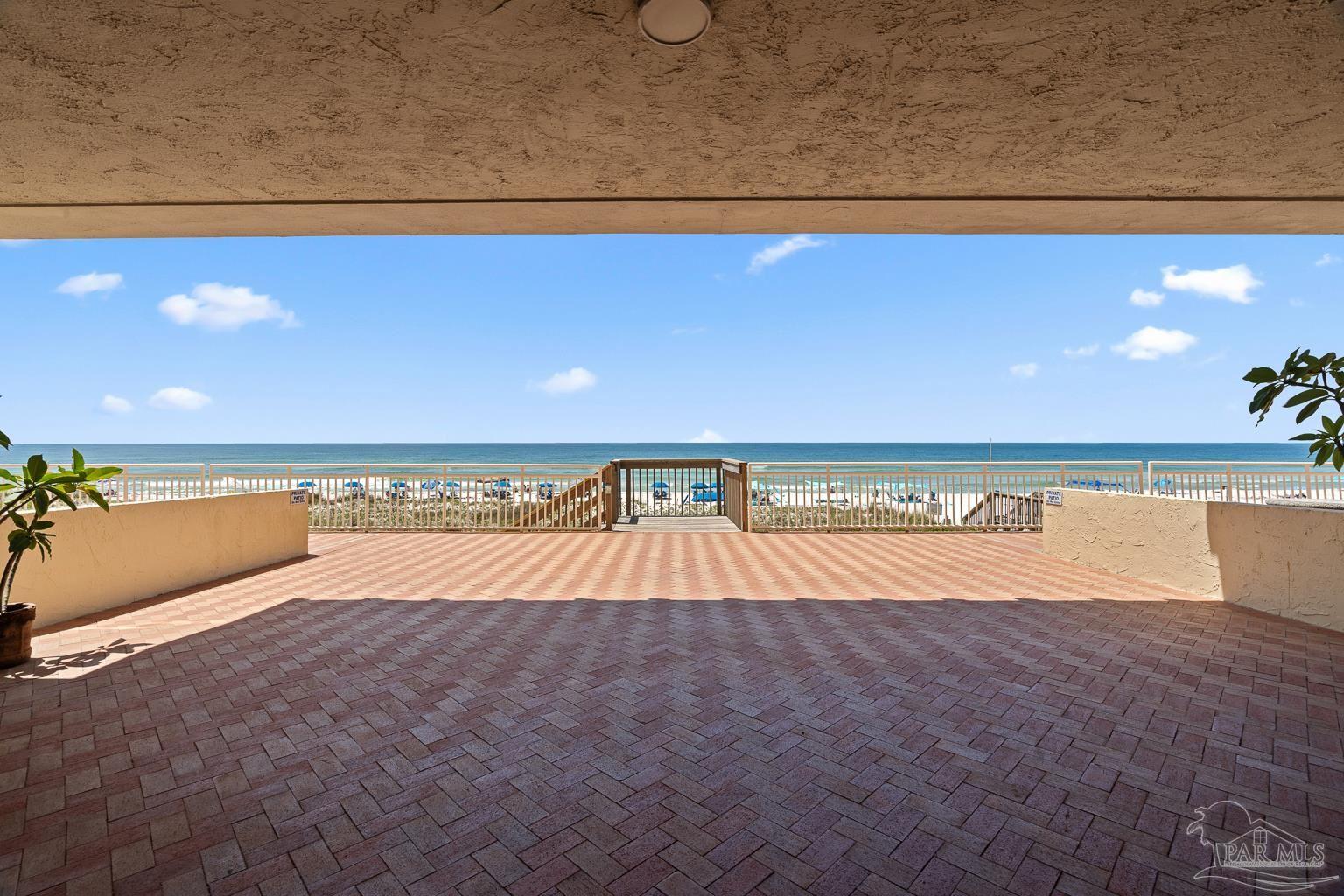 999 Fort Pickens Road, Unit 204 Pensacola Beach, FL 32561 - Photo 35 of 48 a view of a swimming pool and an outdoor space