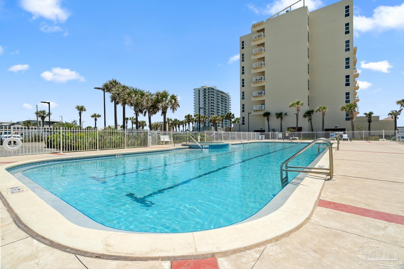 999 Fort Pickens Road, Unit 204 Pensacola Beach, FL 32561 - Photo 41 of 48 a view of a swimming pool with a terrace