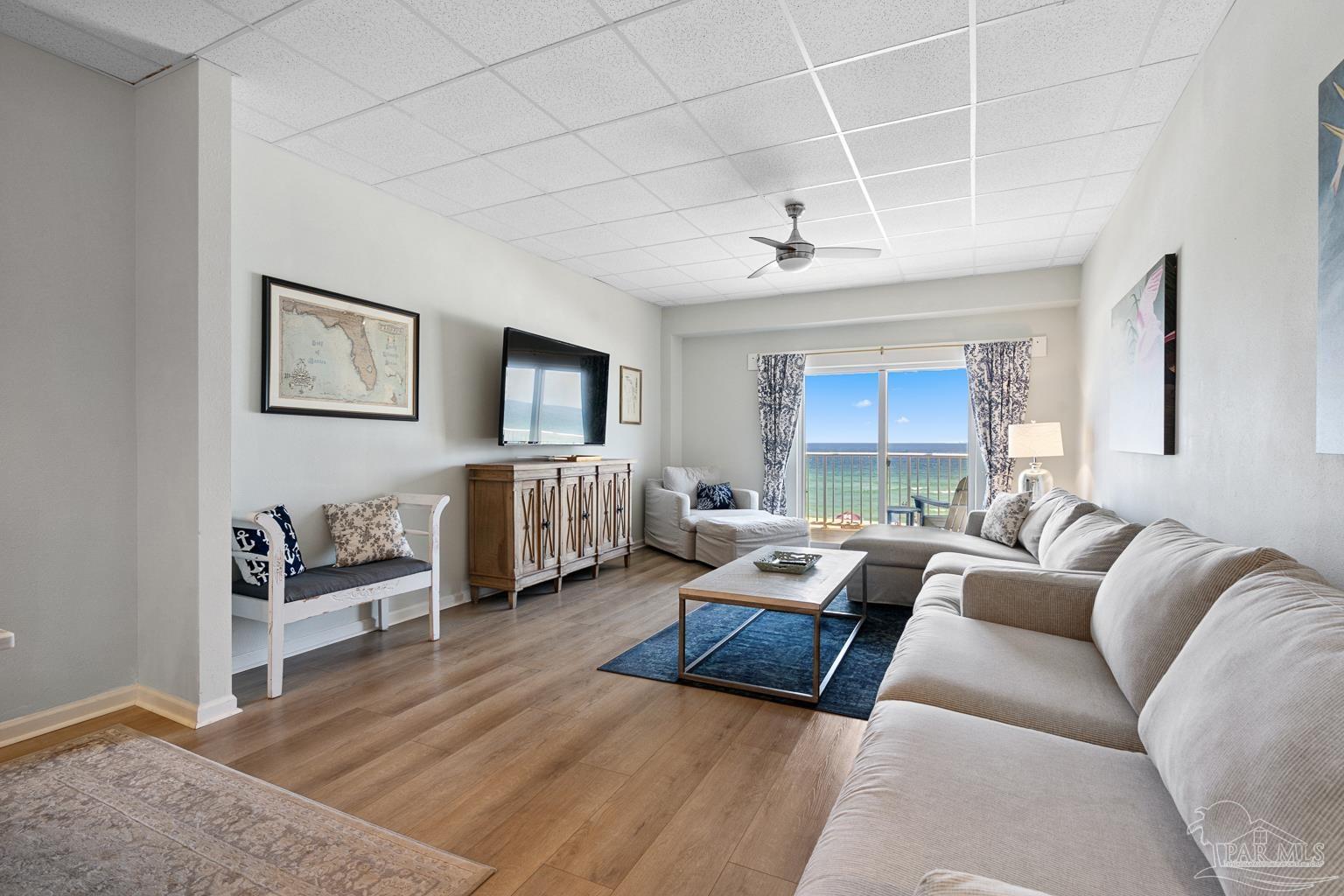 999 Fort Pickens Road, Unit 204 Pensacola Beach, FL 32561 - Photo 5 of 48 a living room with furniture and a large window