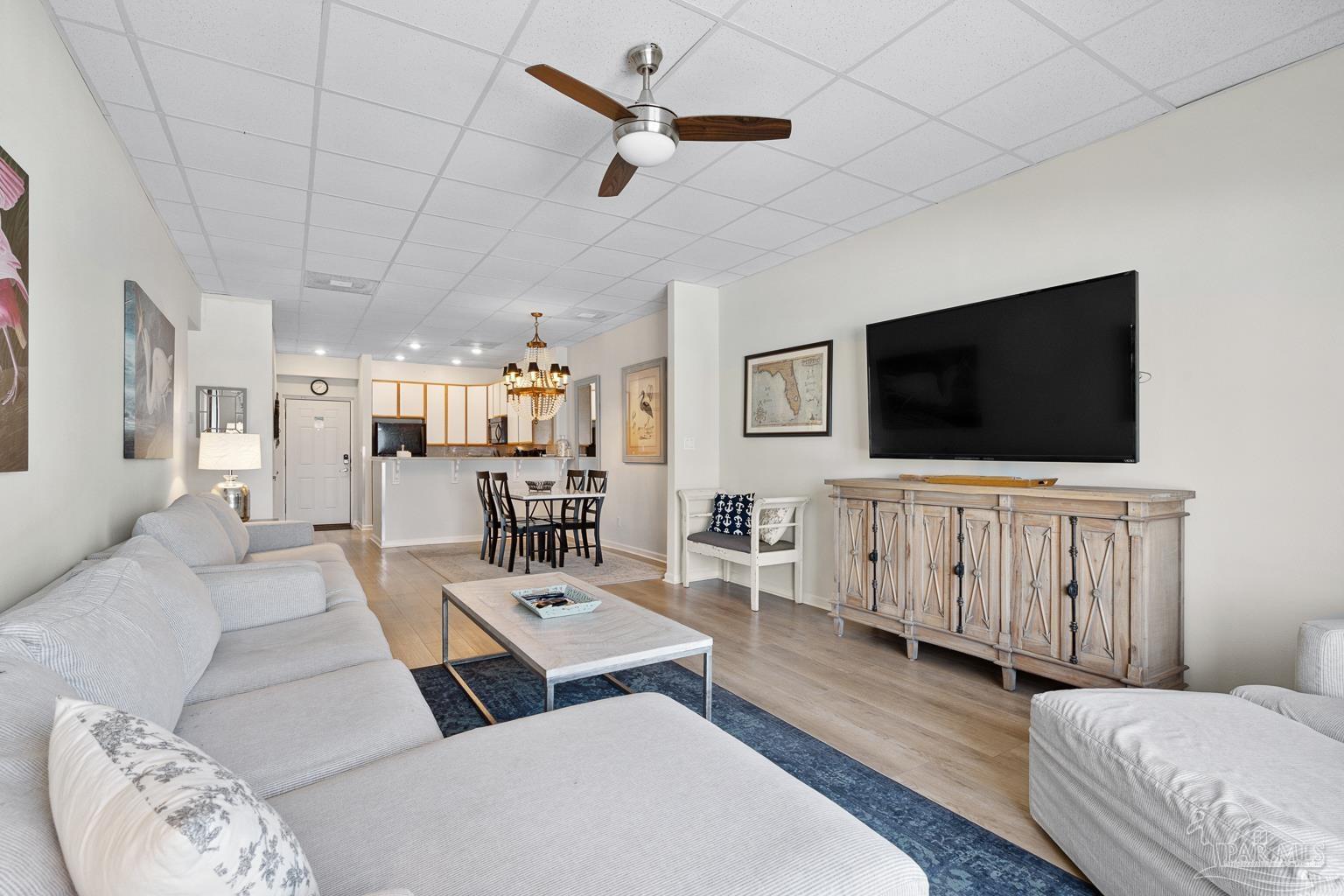 999 Fort Pickens Road, Unit 204 Pensacola Beach, FL 32561 - Photo 8 of 48 a living room with furniture and a flat screen tv