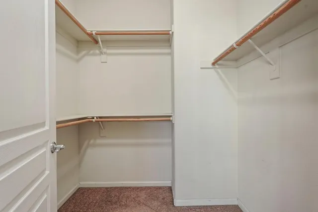 a view of an empty walk in closet