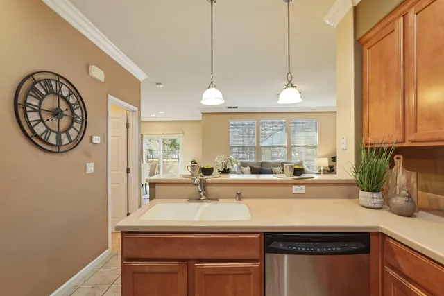 a kitchen with a sink and a window