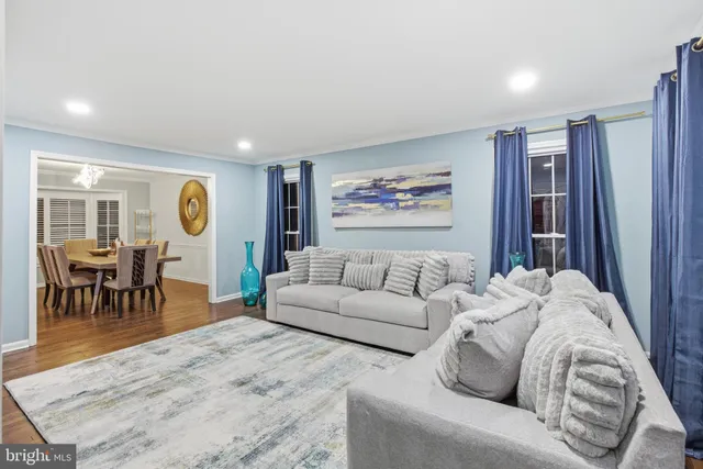 a living room with furniture and a rug