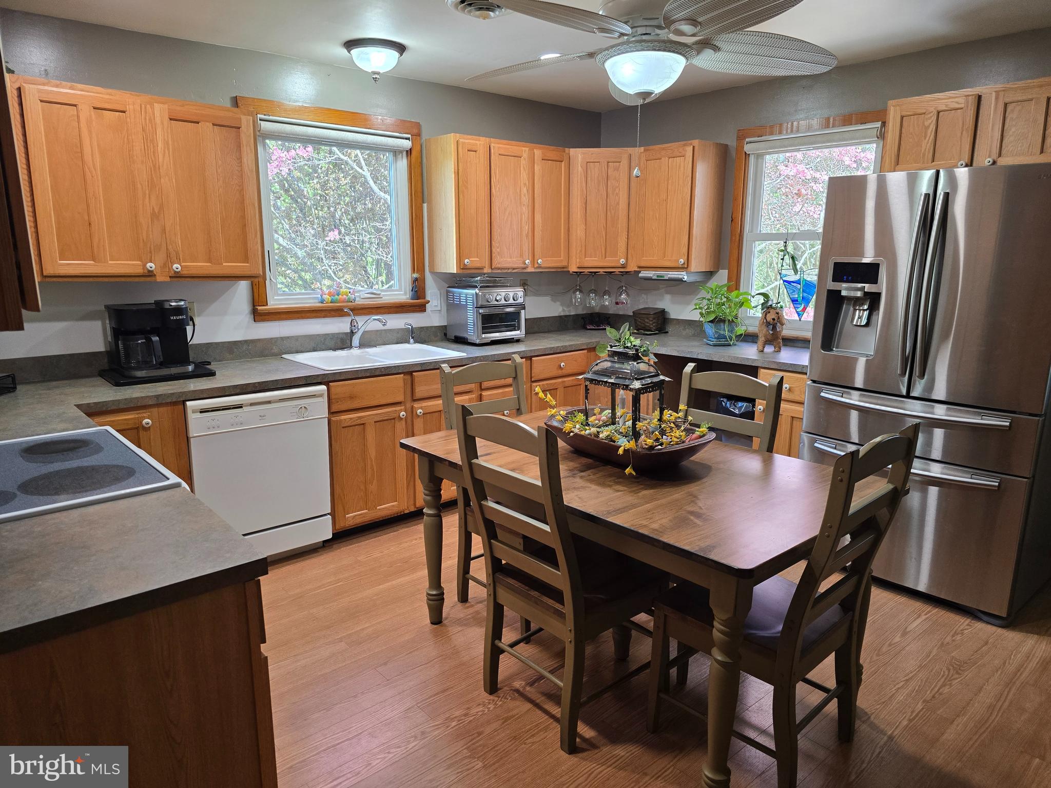 18631 Cherryfield Road Drayden, MD 20630 - Photo 14 of 45 a kitchen with a table chairs refrigerator and window