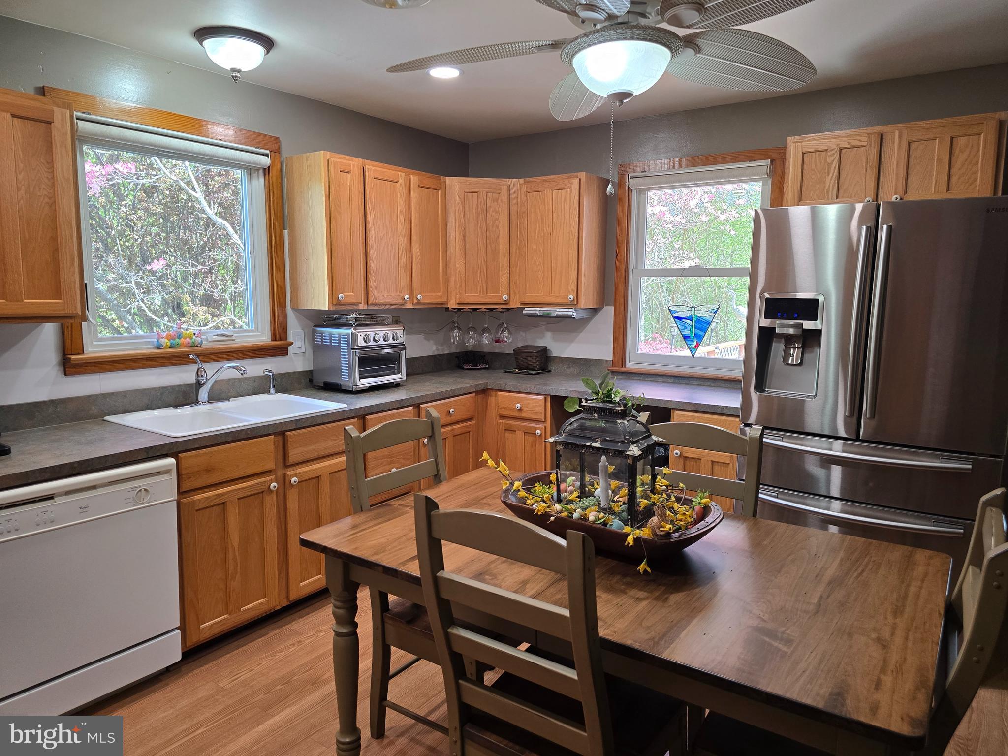 18631 Cherryfield Road Drayden, MD 20630 - Photo 16 of 45 a kitchen with a refrigerator a sink dishwasher a stove and a refrigerator