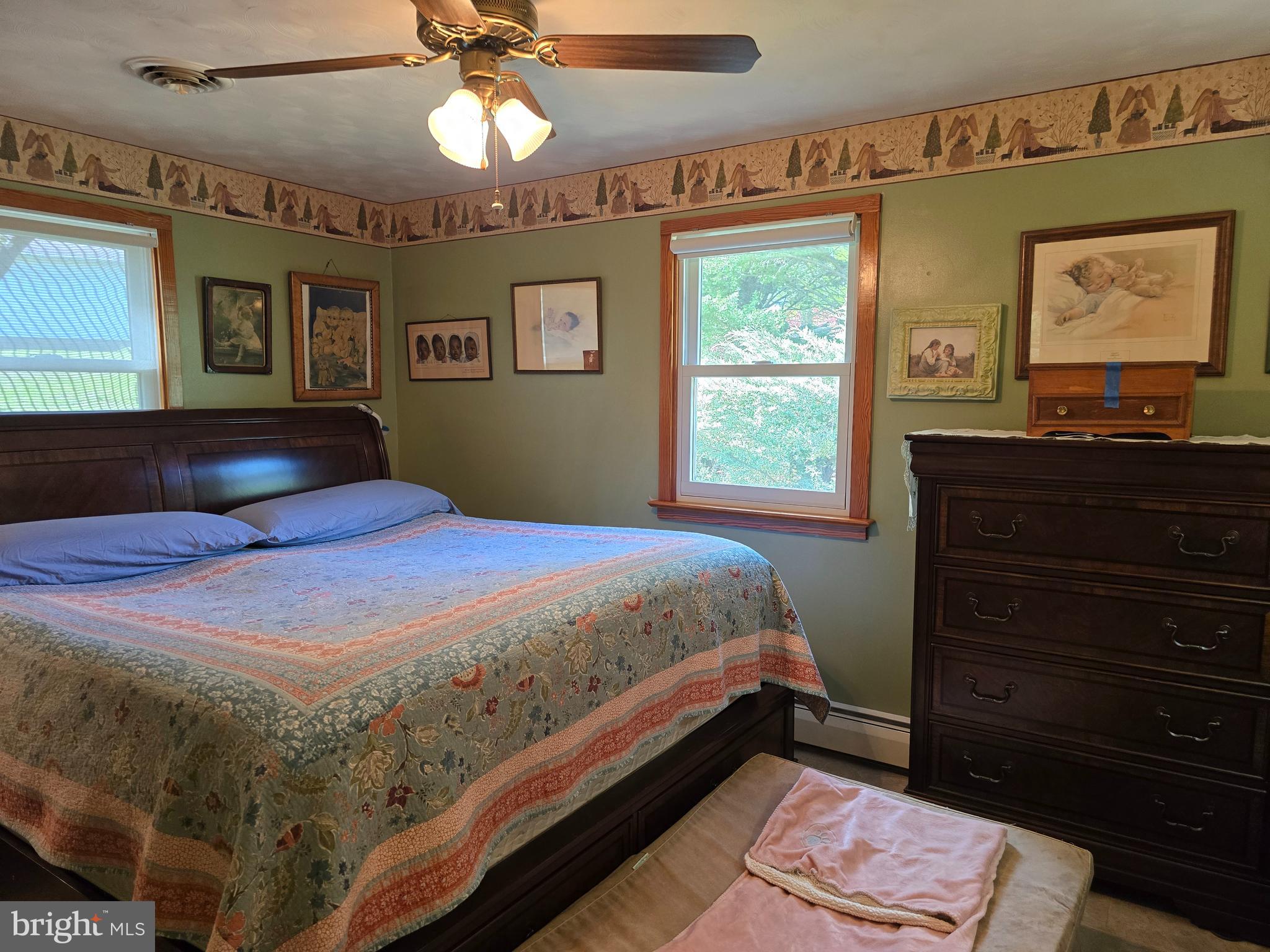 18631 Cherryfield Road Drayden, MD 20630 - Photo 21 of 45 a bedroom with a bed and a chandelier