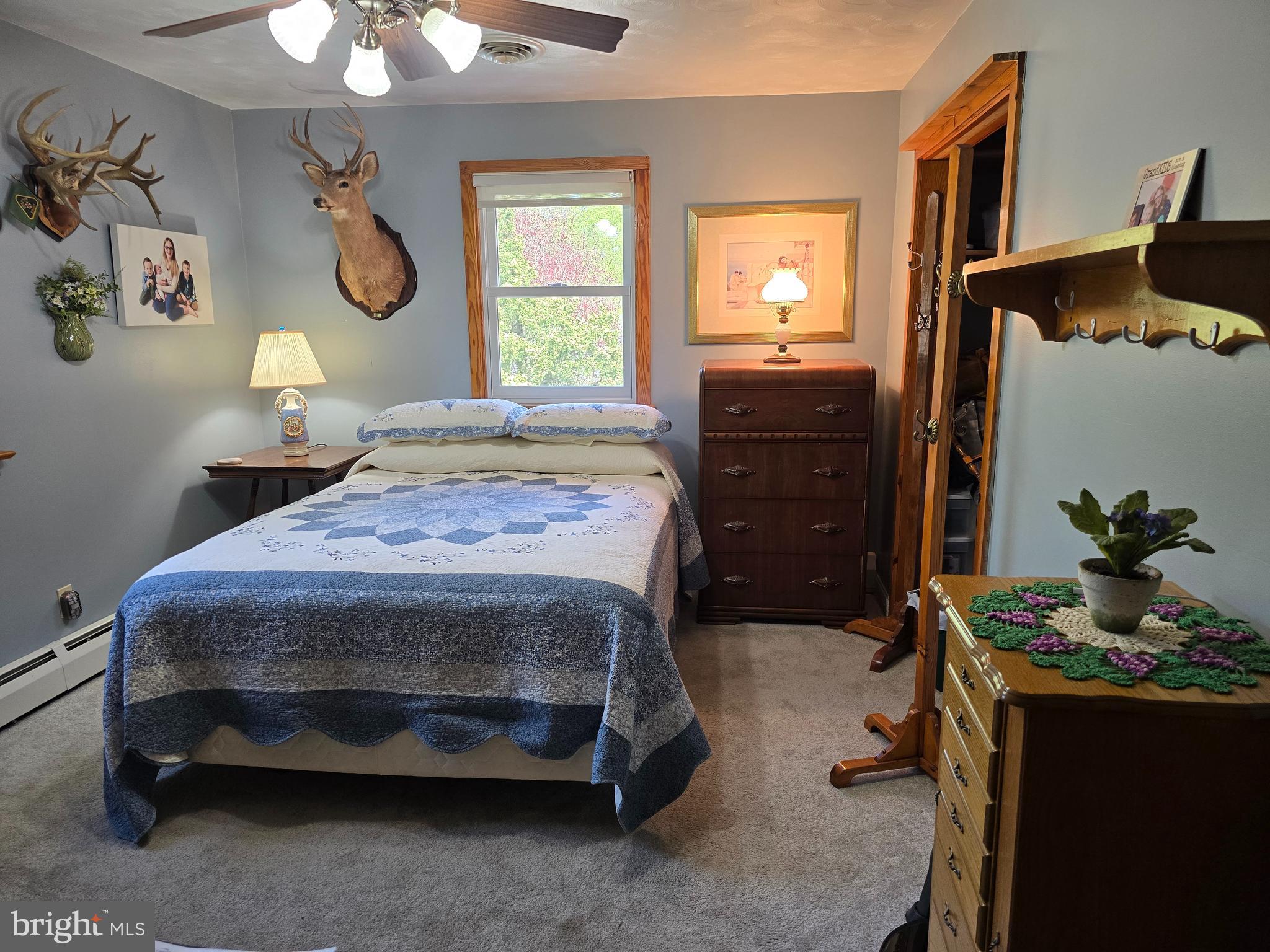 18631 Cherryfield Road Drayden, MD 20630 - Photo 22 of 45 a bedroom with a bed and a chandelier