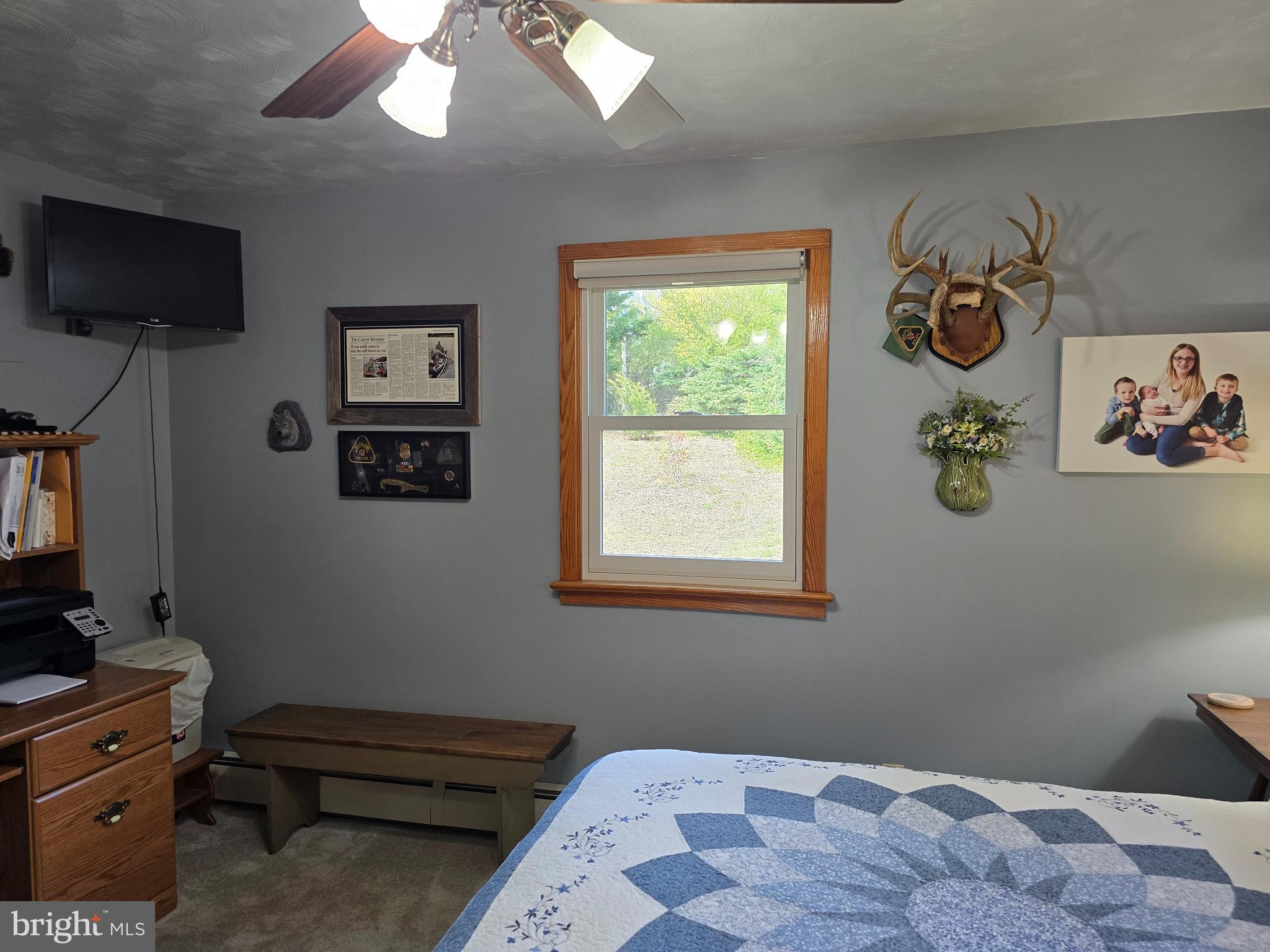 18631 Cherryfield Road Drayden, MD 20630 - Photo 24 of 45 a bedroom with a bed and a flat tv screen on dresser