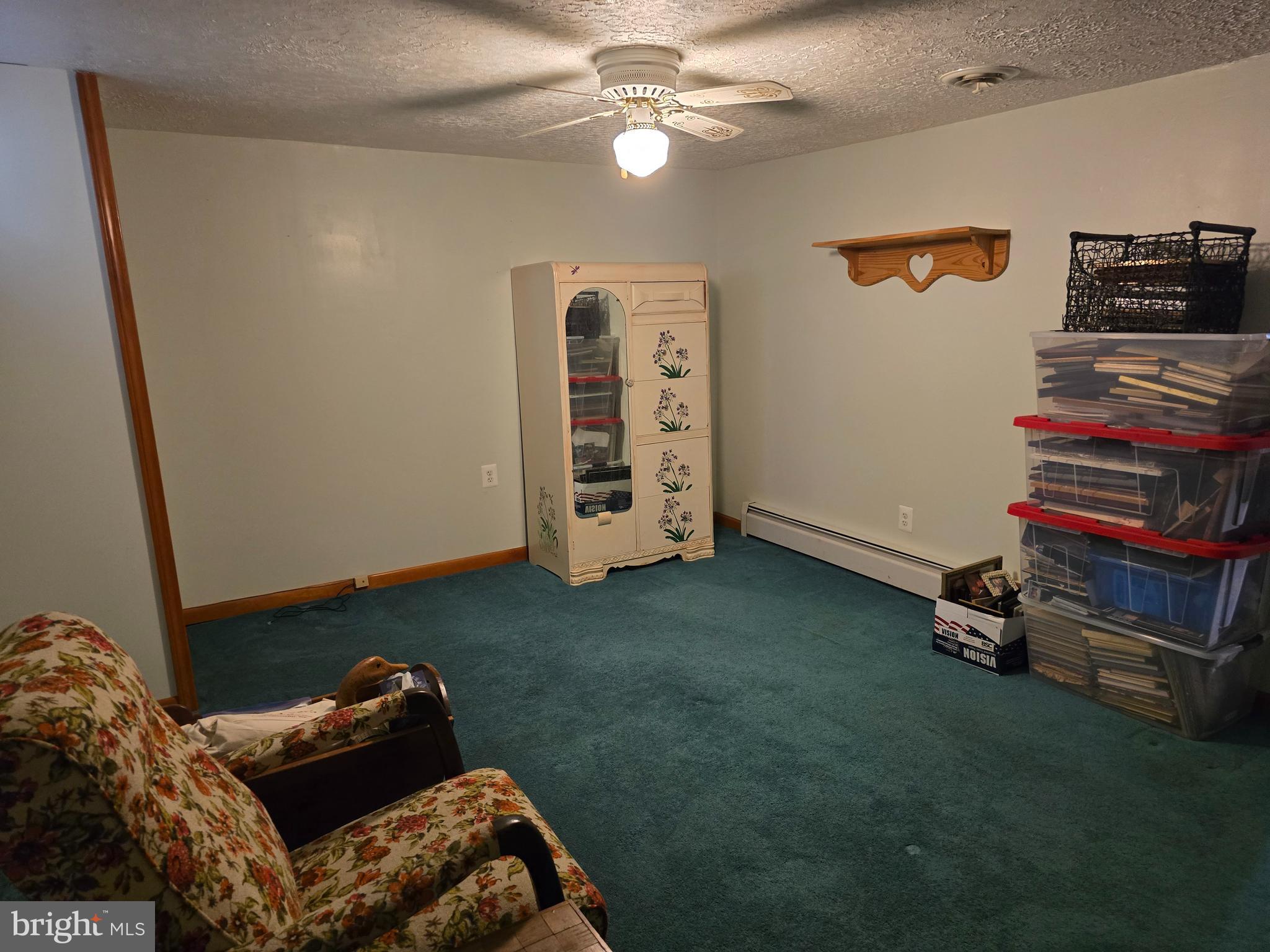 18631 Cherryfield Road Drayden, MD 20630 - Photo 38 of 45 a living room with furniture and a flat screen tv