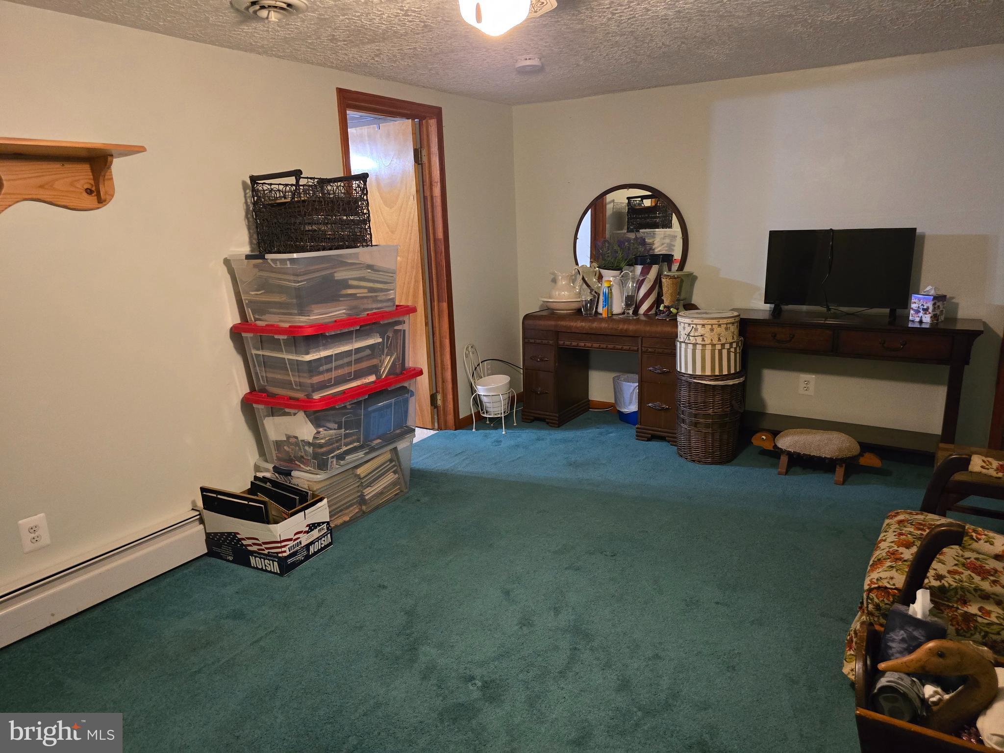 18631 Cherryfield Road Drayden, MD 20630 - Photo 39 of 45 a living room with furniture and a flat screen tv