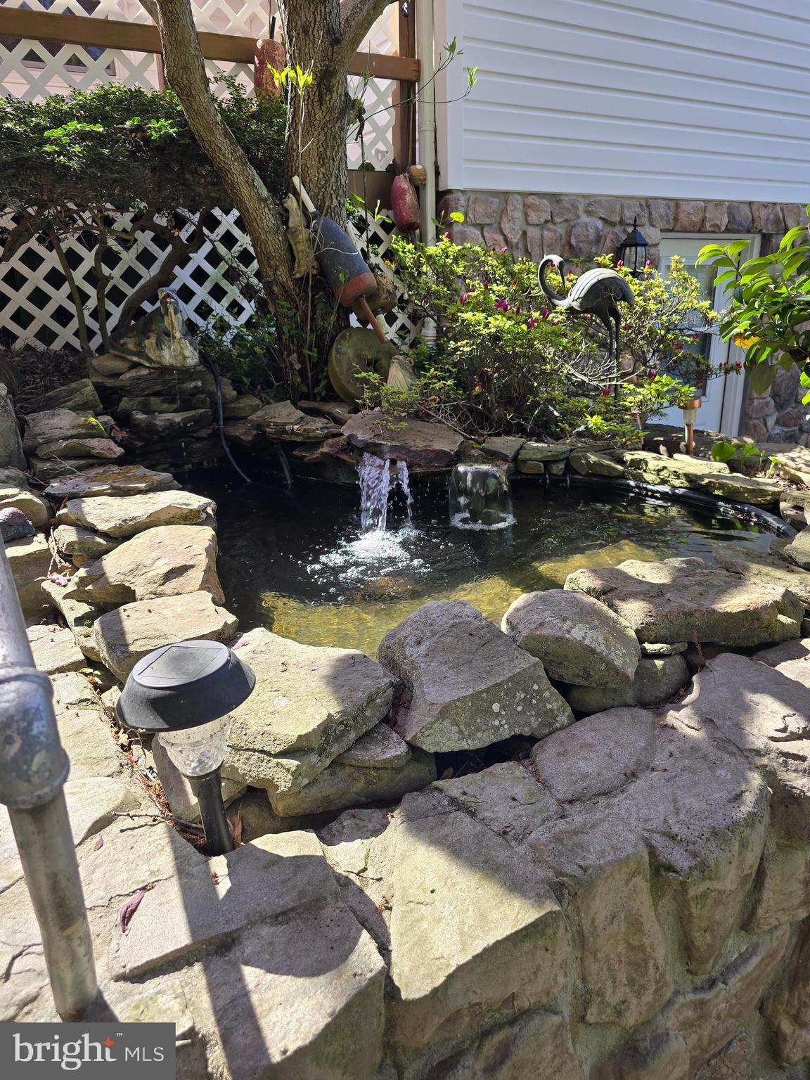 18631 Cherryfield Road Drayden, MD 20630 - Photo 44 of 45 a view of swimming pool with lawn chairs and potted plants