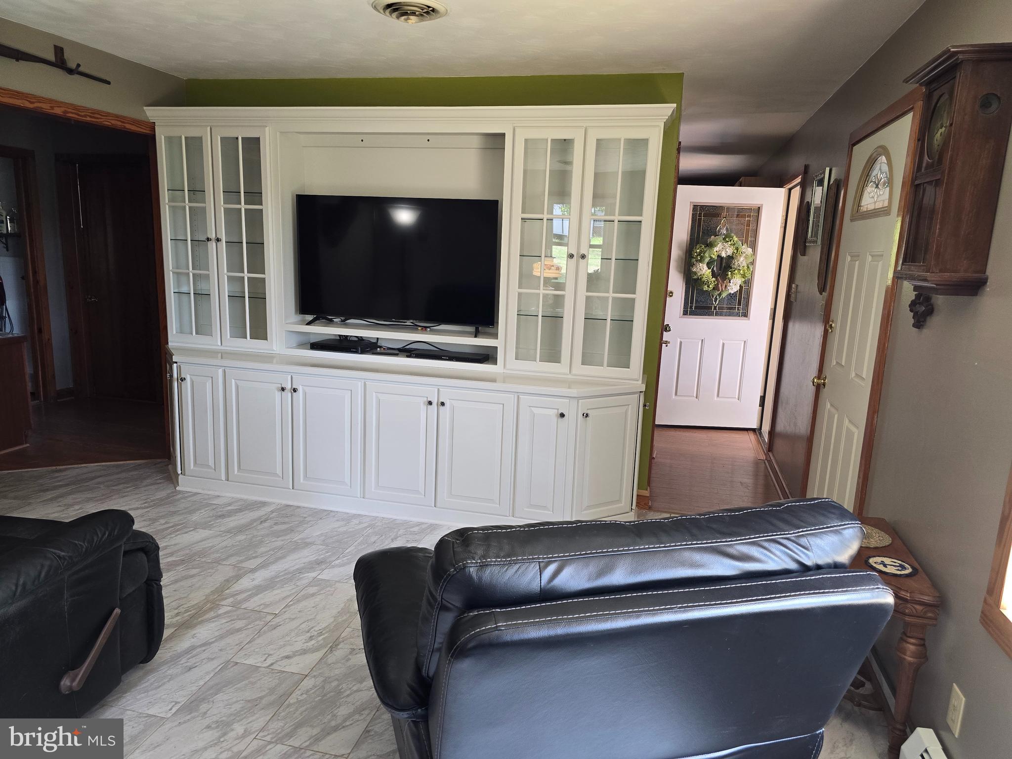18631 Cherryfield Road Drayden, MD 20630 - Photo 9 of 45 a living room with furniture and a flat screen tv