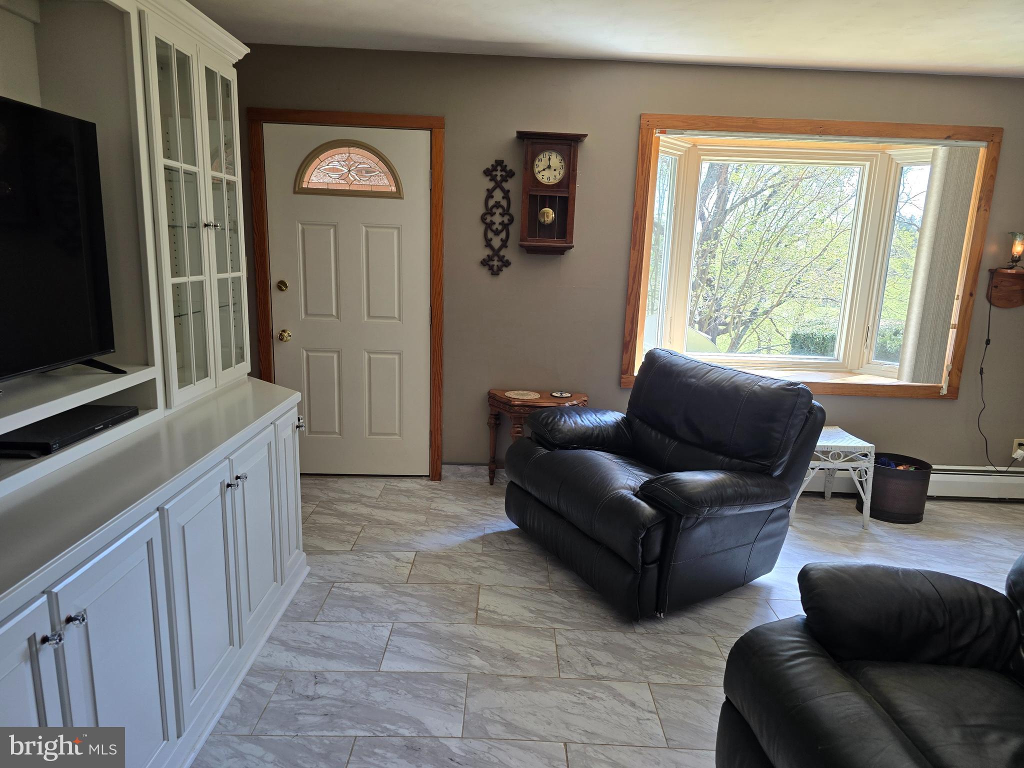 18631 Cherryfield Road Drayden, MD 20630 - Photo 10 of 45 a living room with furniture and a flat screen tv