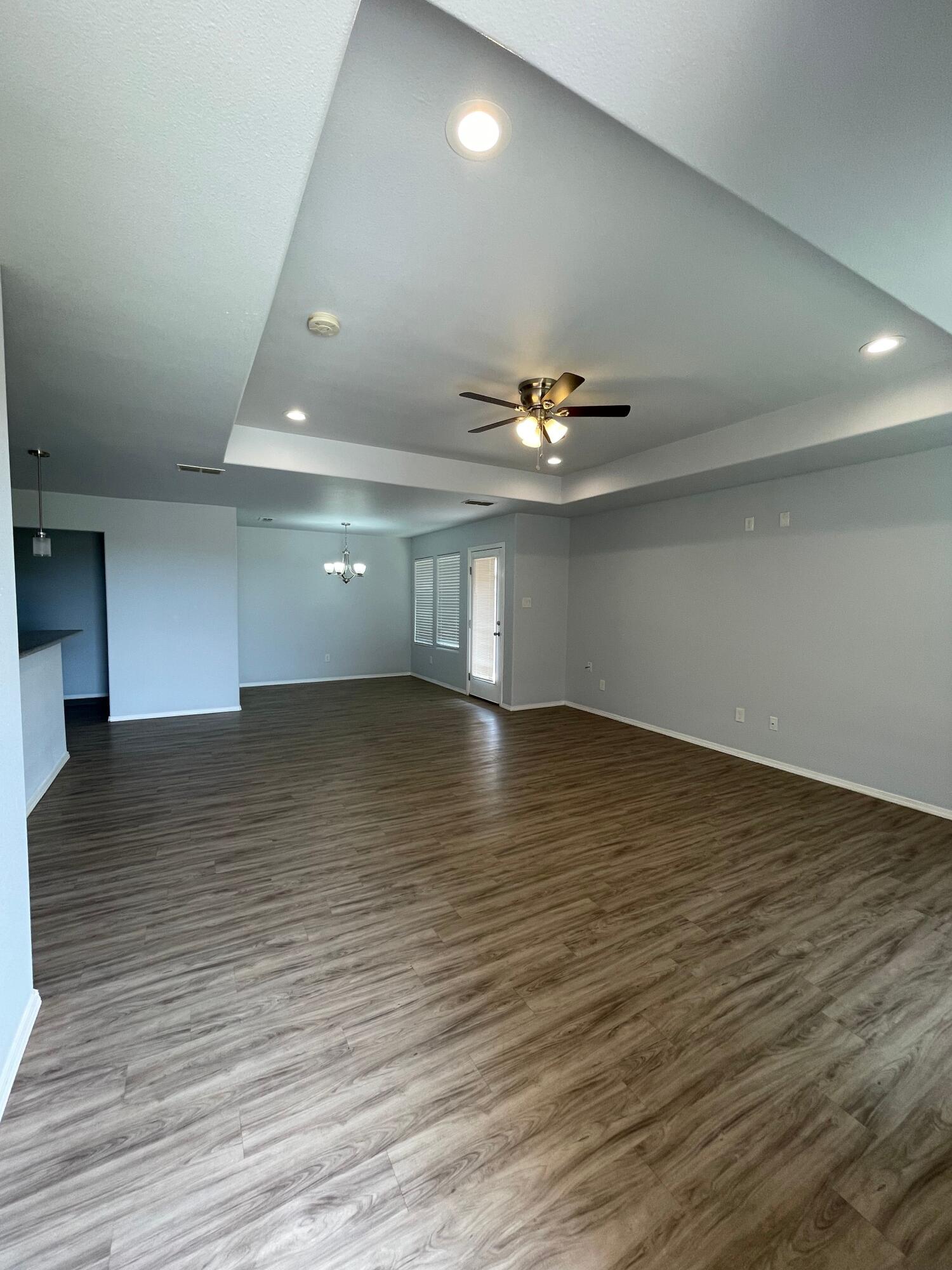 8410 11th Street Lubbock, TX 79416 - Photo 2 of 13 a view of empty room with wooden floor