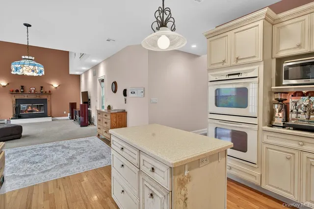 a kitchen with a stove and a refrigerator