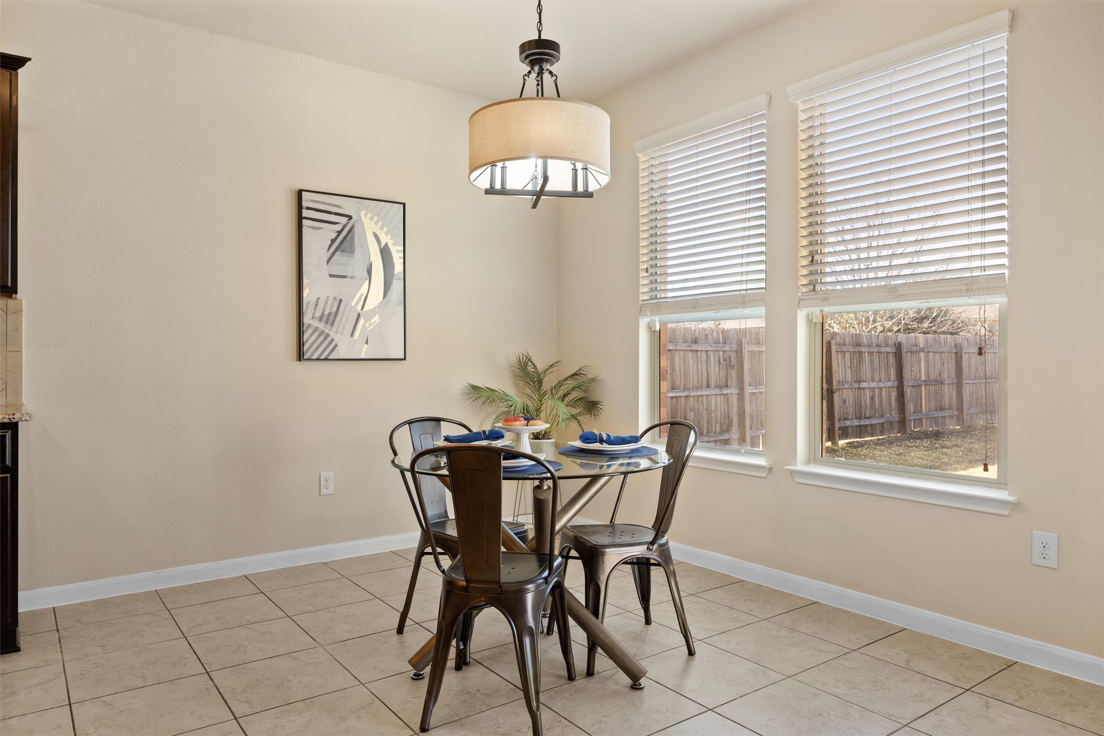 18120 Moreto Loop Pflugerville, TX 78660 - Photo 11 of 29 a view of a dining room with furniture and chandelier