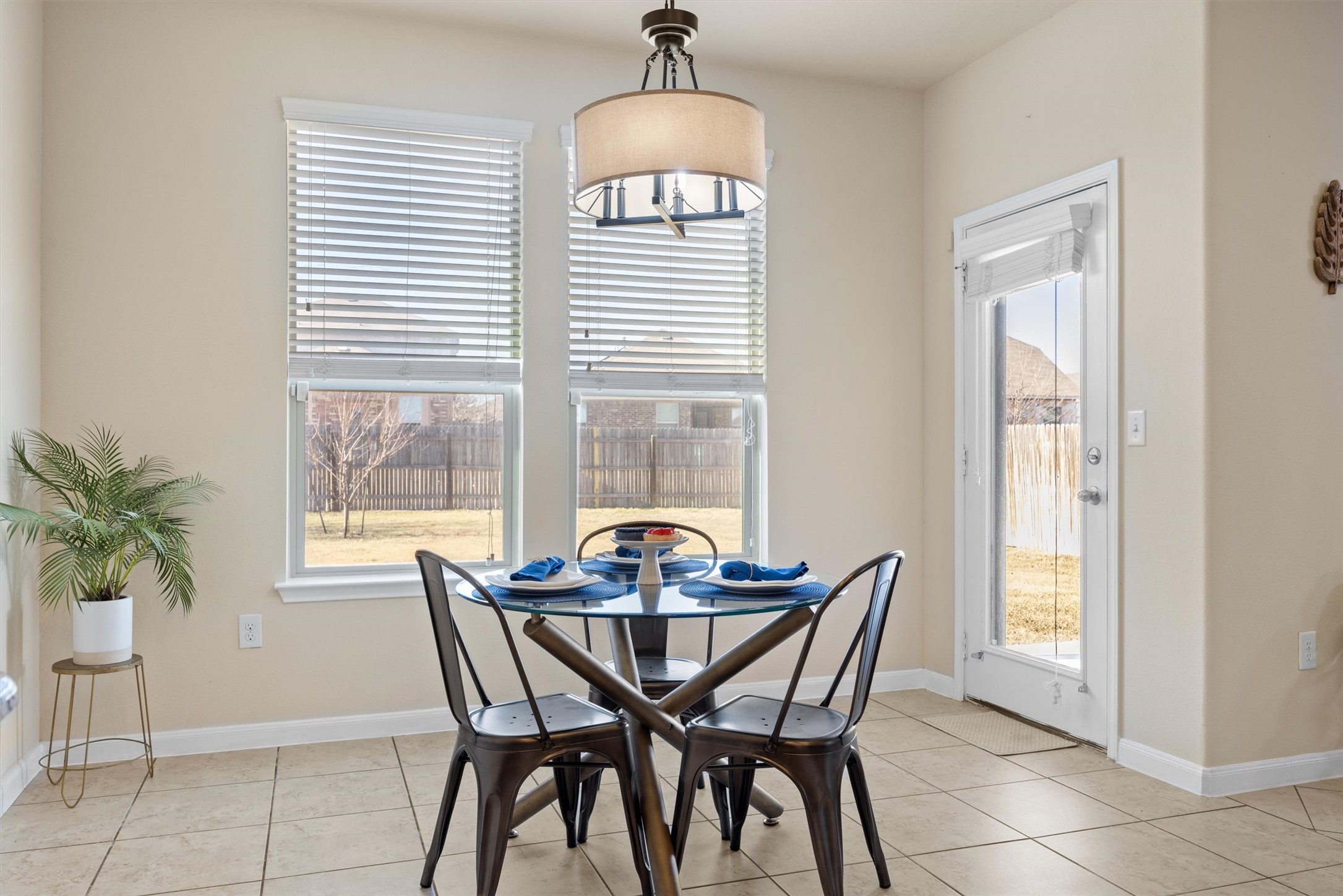 18120 Moreto Loop Pflugerville, TX 78660 - Photo 12 of 29 a dining room with furniture and window