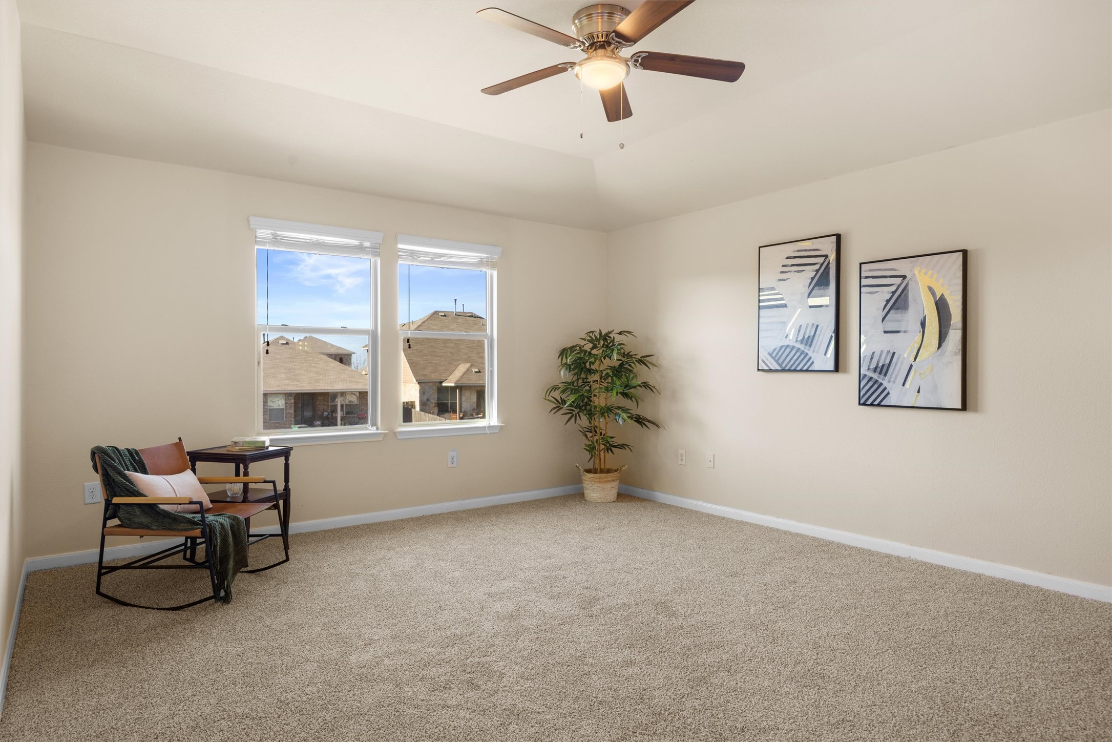 18120 Moreto Loop Pflugerville, TX 78660 - Photo 16 of 28 Living area featuring carpet flooring and ceiling fan