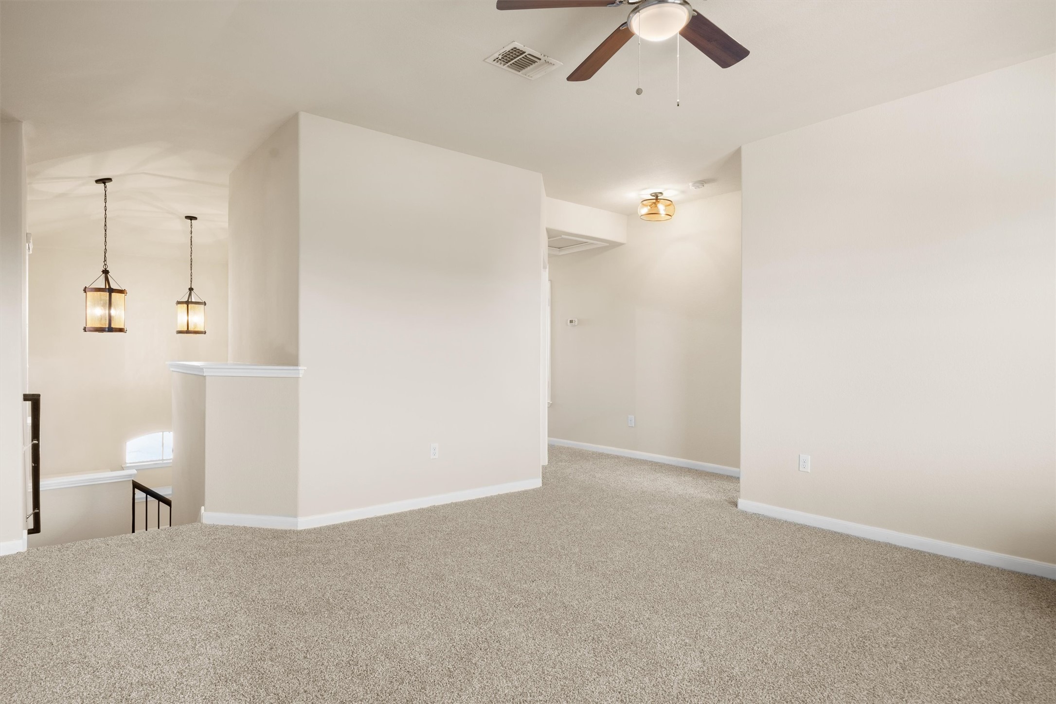 18120 Moreto Loop Pflugerville, TX 78660 - Photo 17 of 28 Carpeted spare room featuring baseboards and a ceiling fan