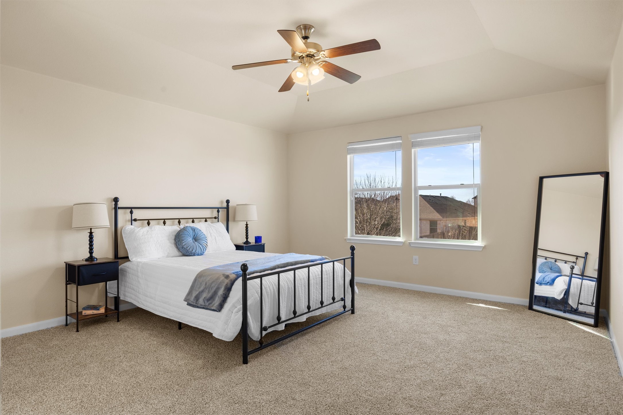 18120 Moreto Loop Pflugerville, TX 78660 - Photo 18 of 28 Light-filled primary bedroom with ceiling fan