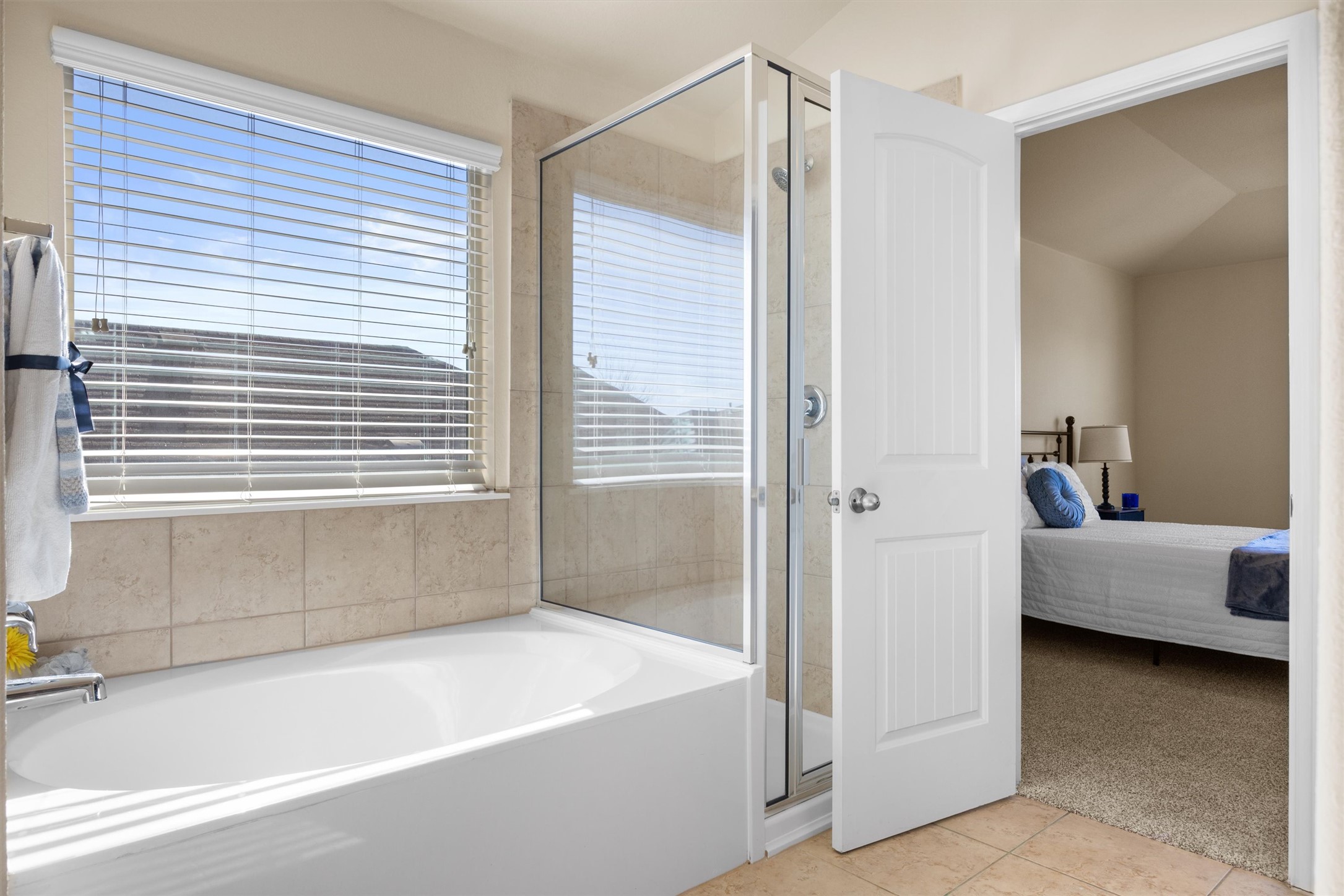18120 Moreto Loop Pflugerville, TX 78660 - Photo 22 of 28 Ensuite bathroom featuring tub and step-in shower